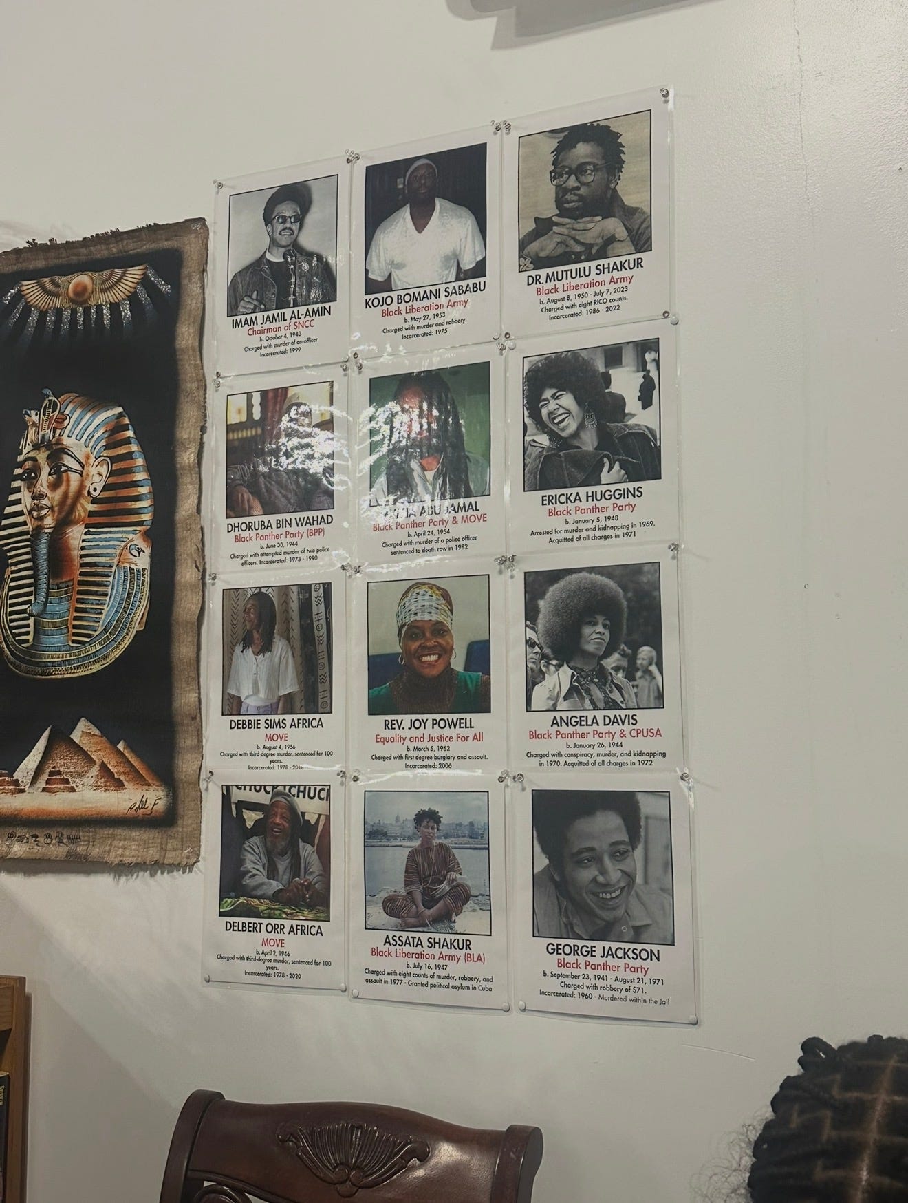 The wall inside Cafe Resistance in Jacksonville, with the Assata Shakur portrait visible