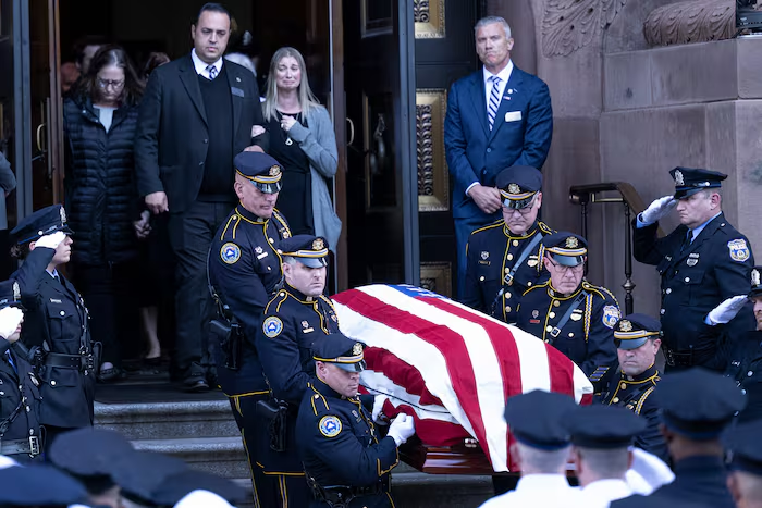 Philadelphia police officers carry the flag-draped casket of Officer Shane Seiber out of the Cathedral Basilica of Saints Peter and Paul following his funeral